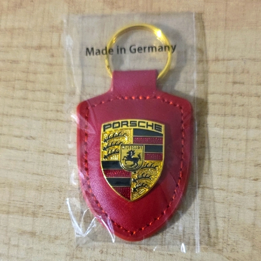Porsche Design Red Keychain with Gold Emblem
